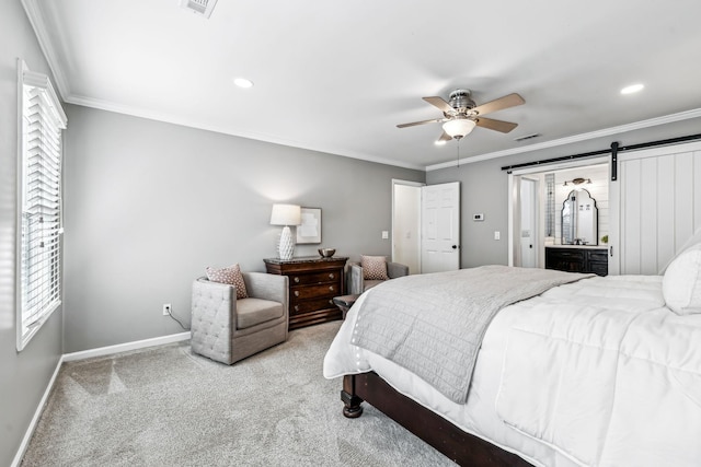 bedroom featuring multiple windows, a barn door, light colored carpet, and ceiling fan