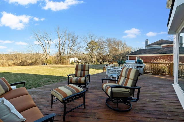 wooden terrace with a lawn