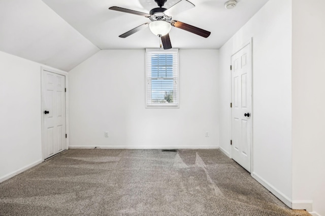 bonus room with lofted ceiling, ceiling fan, and carpet flooring