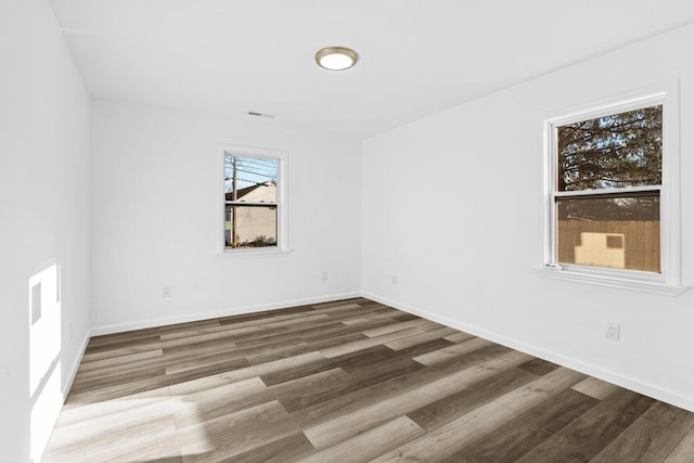 empty room with wood-type flooring