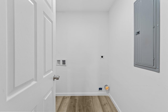 laundry area featuring electric dryer hookup, hardwood / wood-style floors, hookup for a washing machine, and electric panel