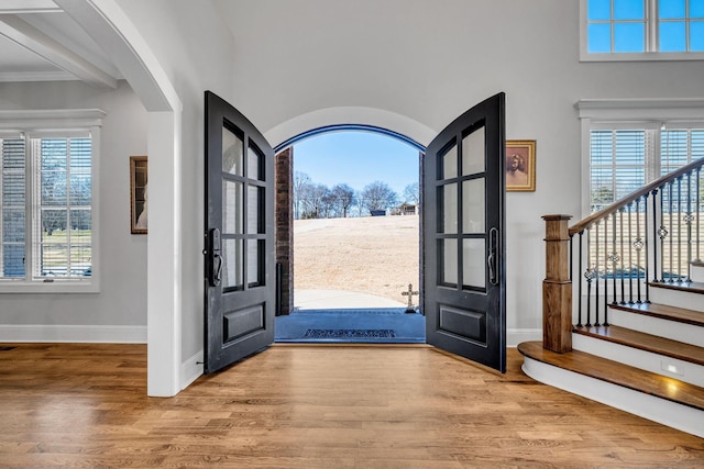 foyer entrance with hardwood / wood-style floors