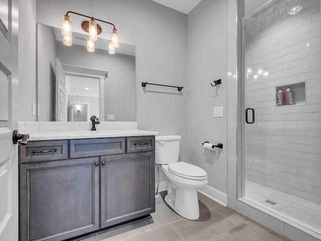 bathroom featuring vanity, an enclosed shower, tile patterned floors, and toilet