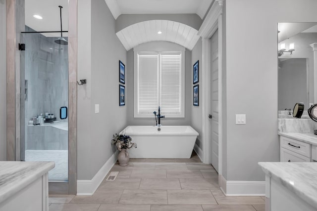 bathroom featuring vanity and plus walk in shower