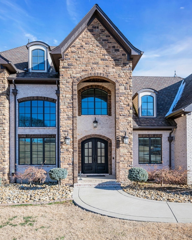 entrance to property featuring french doors