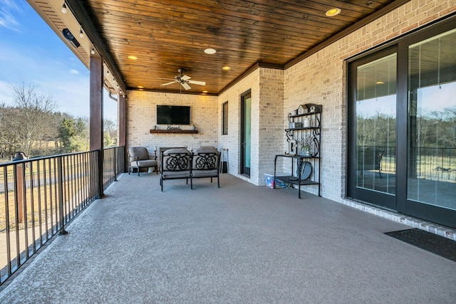 view of patio featuring a balcony and ceiling fan