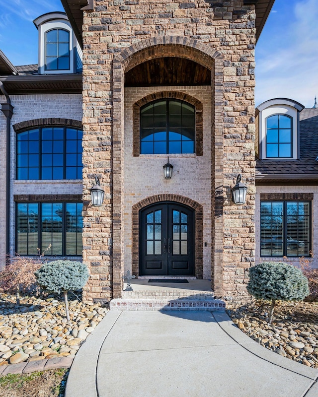 property entrance featuring french doors