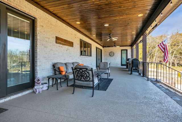 view of patio / terrace featuring area for grilling and ceiling fan