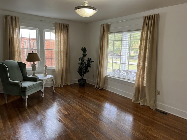 sitting room with dark hardwood / wood-style floors