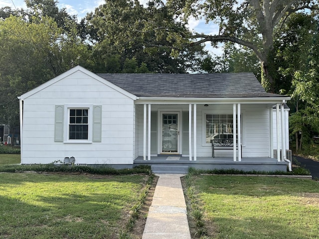 bungalow-style home with a porch and a front yard