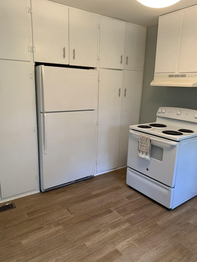 kitchen featuring white cabinetry, white appliances, and hardwood / wood-style flooring