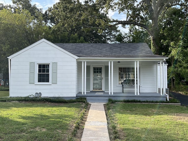 bungalow-style house with covered porch and a front yard