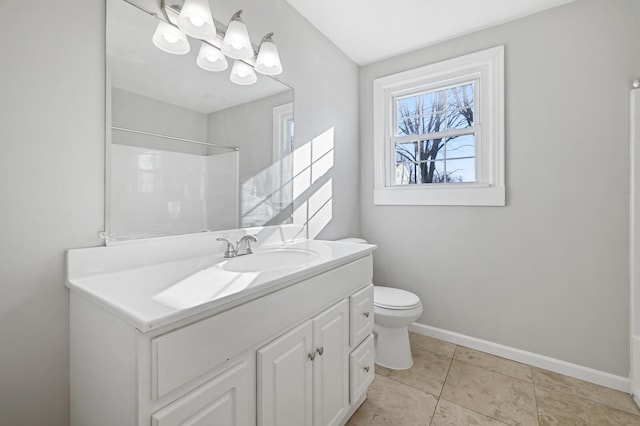 bathroom featuring vanity, tile patterned flooring, toilet, and an inviting chandelier