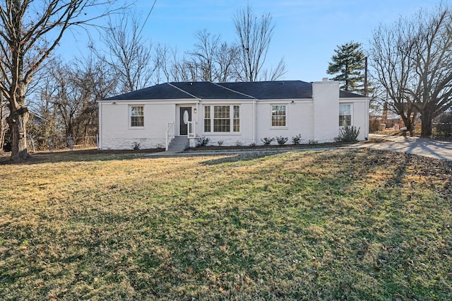 ranch-style house featuring a front lawn