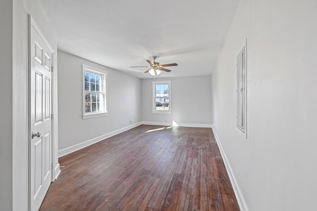 unfurnished room with ceiling fan and dark hardwood / wood-style floors