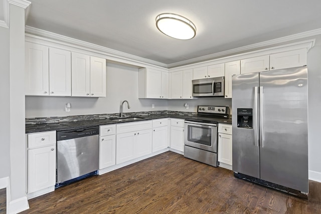 kitchen with white cabinetry, sink, stainless steel appliances, crown molding, and dark wood-type flooring