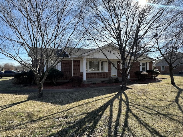 ranch-style home with a front lawn