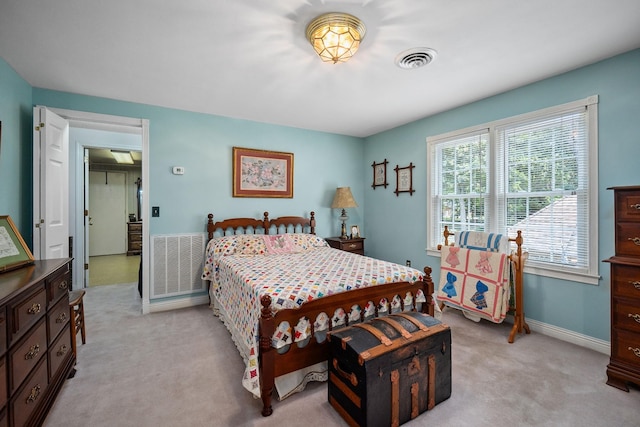 bedroom with light carpet