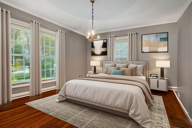 bedroom featuring multiple windows, crown molding, dark hardwood / wood-style floors, and ceiling fan with notable chandelier