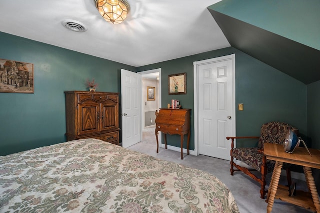 carpeted bedroom featuring vaulted ceiling