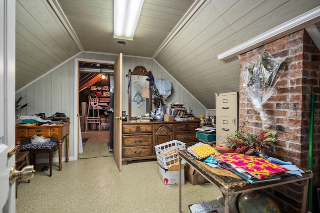 interior space with lofted ceiling and wood walls