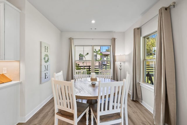 dining room with light wood-type flooring