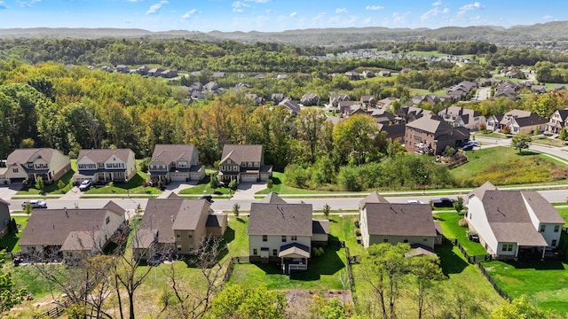 birds eye view of property with a mountain view