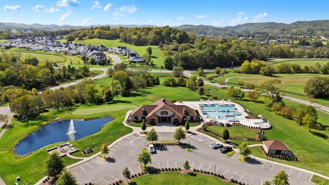 birds eye view of property featuring a water and mountain view