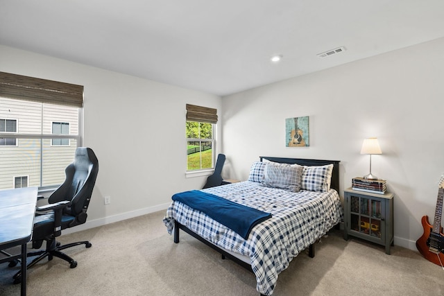 bedroom featuring light carpet