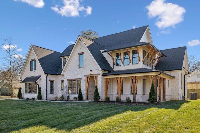 view of front of home featuring cooling unit, a porch, and a front yard