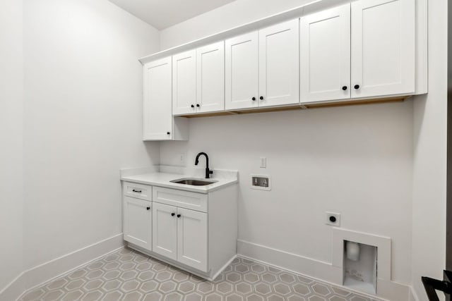 laundry room featuring cabinets, hookup for an electric dryer, sink, and washer hookup