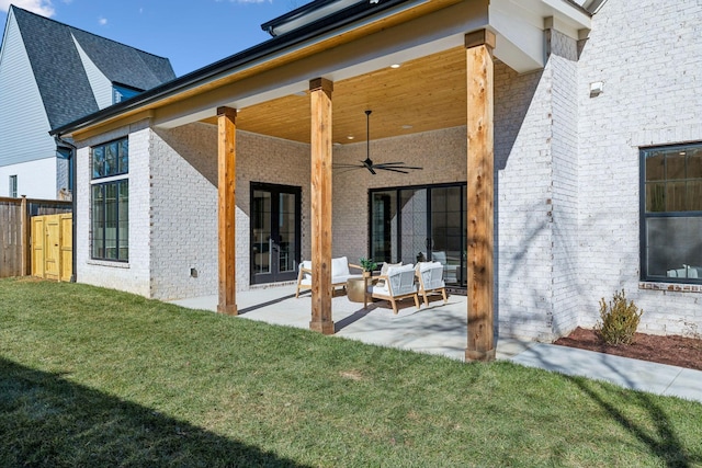 rear view of house featuring an outdoor hangout area, a lawn, ceiling fan, and a patio area