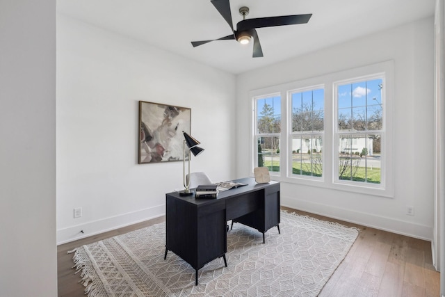 office area with hardwood / wood-style flooring and ceiling fan