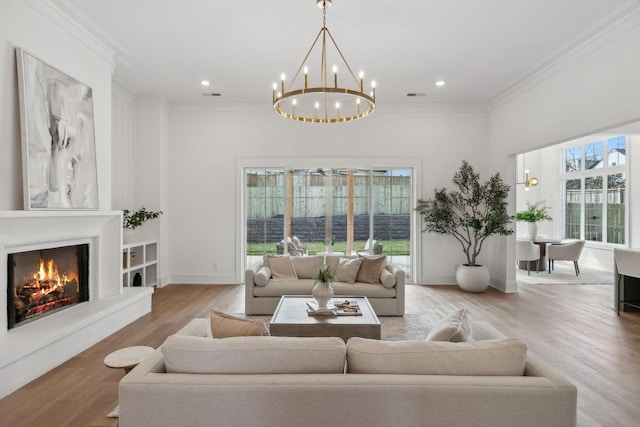 living room with hardwood / wood-style floors and ornamental molding