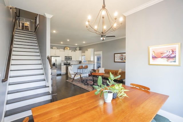 dining area with ornamental molding and a chandelier