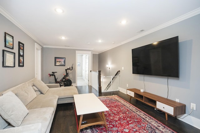 living room with crown molding and hardwood / wood-style floors