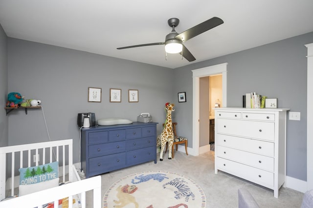 bedroom featuring ceiling fan and light colored carpet