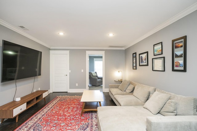 living room with ornamental molding and dark hardwood / wood-style flooring