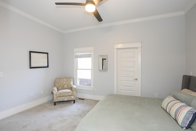 carpeted bedroom featuring crown molding and ceiling fan