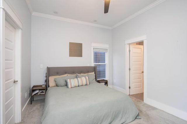 carpeted bedroom featuring ornamental molding and ceiling fan