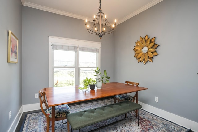 dining room featuring ornamental molding and an inviting chandelier