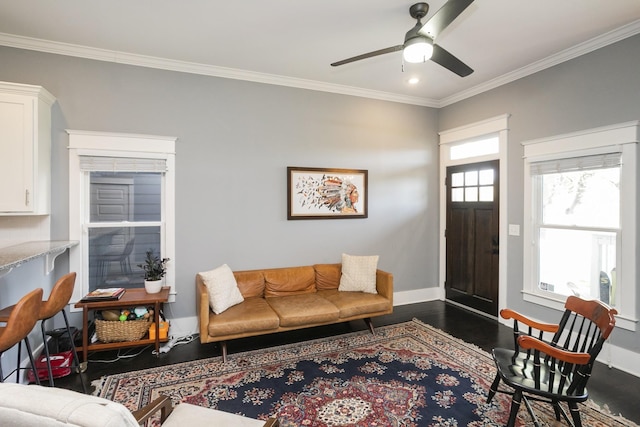 living room featuring ornamental molding, ceiling fan, and dark hardwood / wood-style flooring