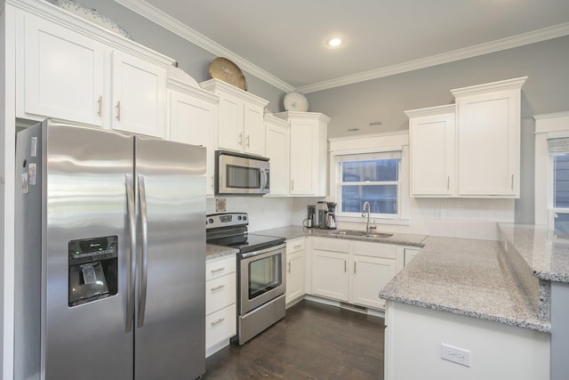 kitchen featuring sink, white cabinetry, appliances with stainless steel finishes, dark hardwood / wood-style flooring, and backsplash