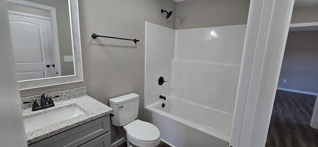 full bathroom featuring vanity, wood-type flooring, shower / tub combination, and toilet