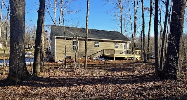 rear view of house featuring a deck