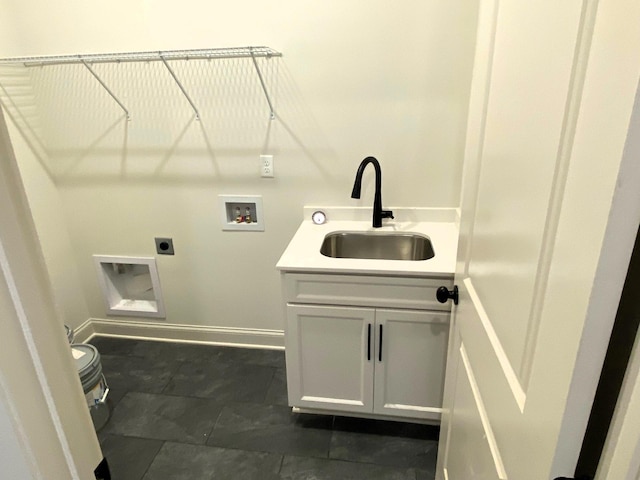 laundry area with washer hookup, a sink, baseboards, cabinet space, and electric dryer hookup