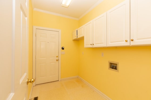 laundry area with cabinets, ornamental molding, and washer hookup