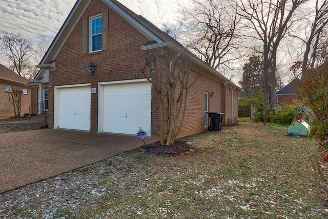 view of side of home featuring a garage