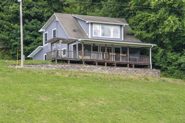 view of front of home with a pergola and a front lawn