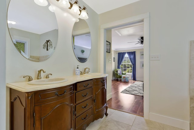 bathroom featuring tile patterned flooring, vanity, and ceiling fan